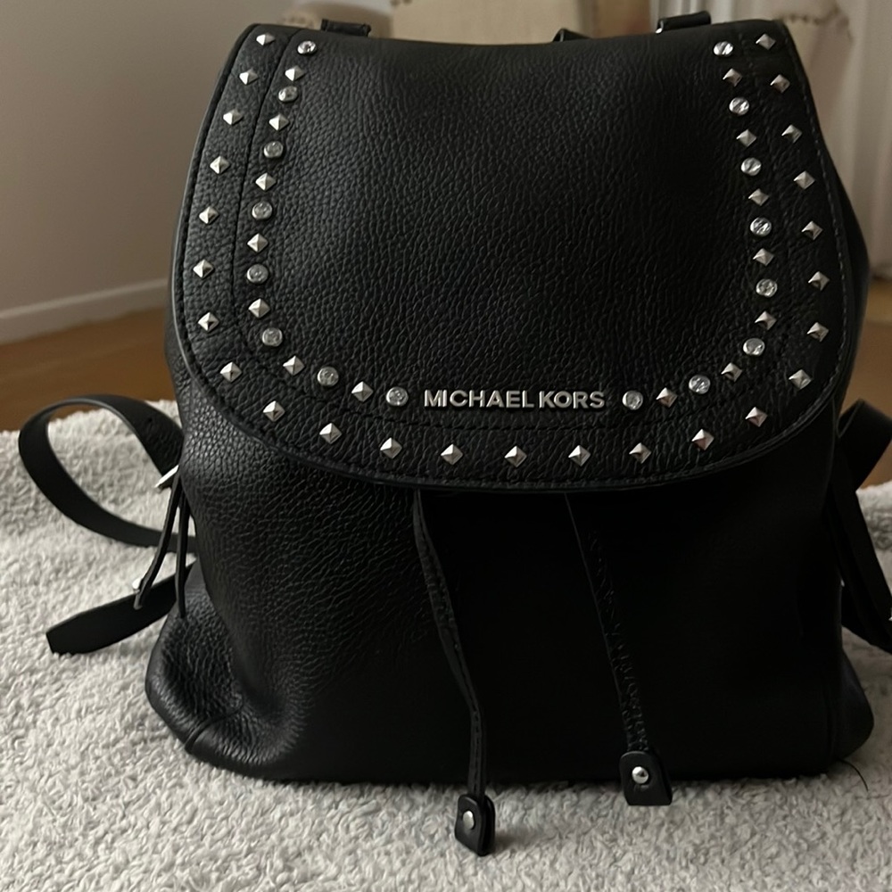 Michael Kors studded backpack.